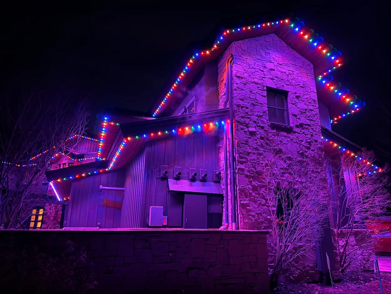 Subtle exterior lighting on home eaves at dusk
